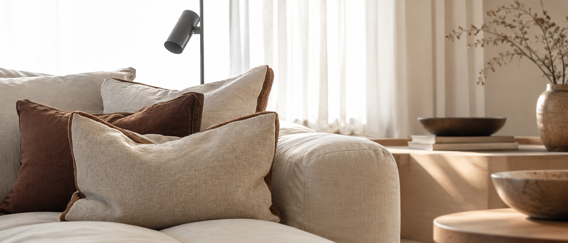 Soft bedding layered in calm natural tones